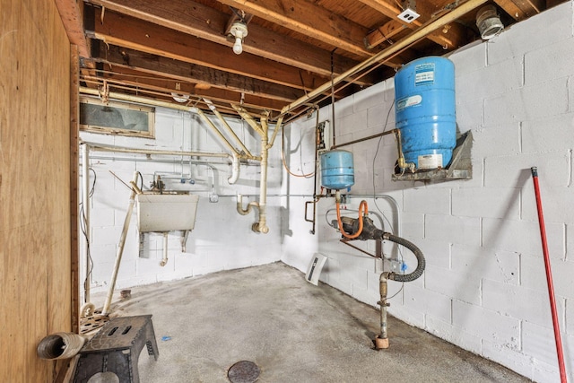 4235 277th Ave NW, Isanti, MN 55040 - unfinished basement with a water pressure tank and a sink