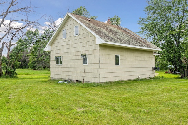 4235 277th Ave NW, Isanti, MN 55040 - view of property exterior featuring a lawn, a chimney, and a shingled roof