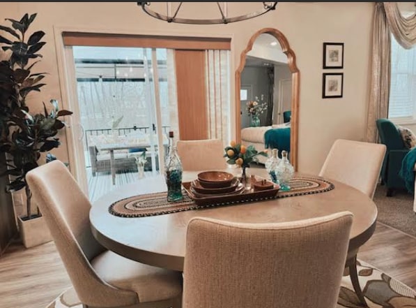 dining space featuring light wood-style floors