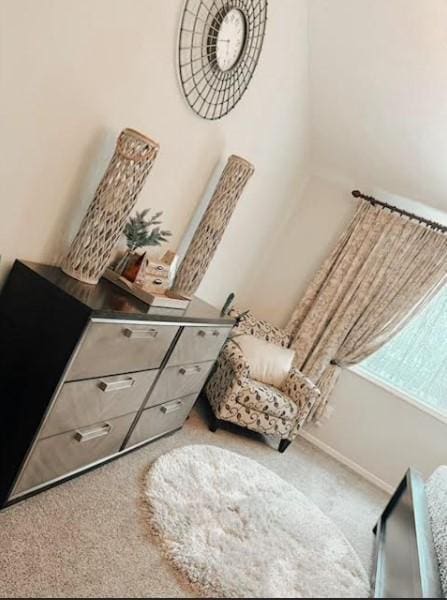 interior space with carpet floors and baseboards