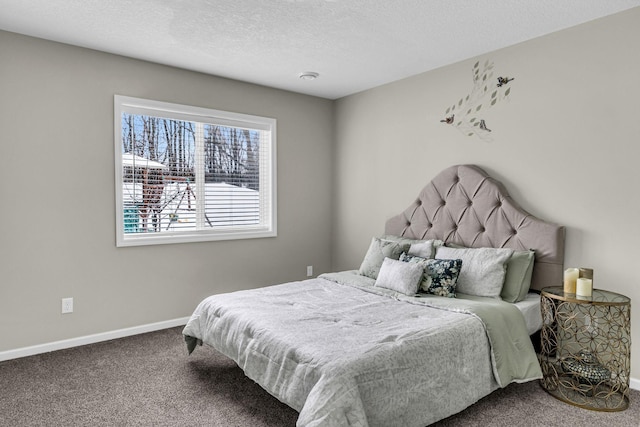 bedroom with baseboards, carpet, and a textured ceiling