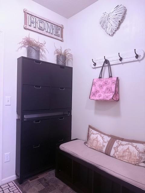 mudroom featuring baseboards