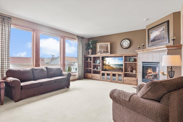 living room featuring a fireplace and carpet floors