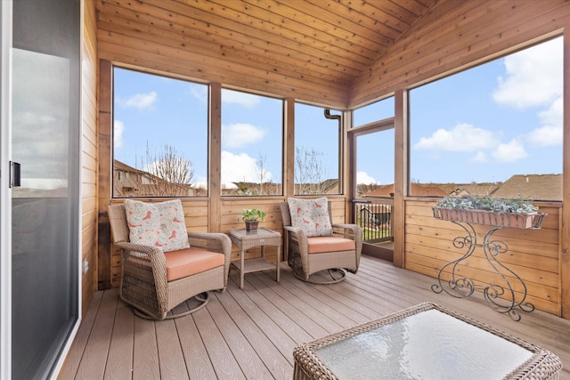 sunroom / solarium featuring lofted ceiling, hardwood / wood-style floors, and wood ceiling