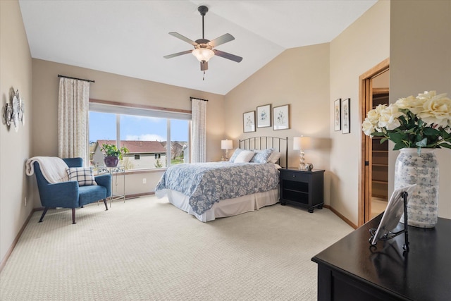 bedroom with light colored carpet, vaulted ceiling, a ceiling fan, and baseboards