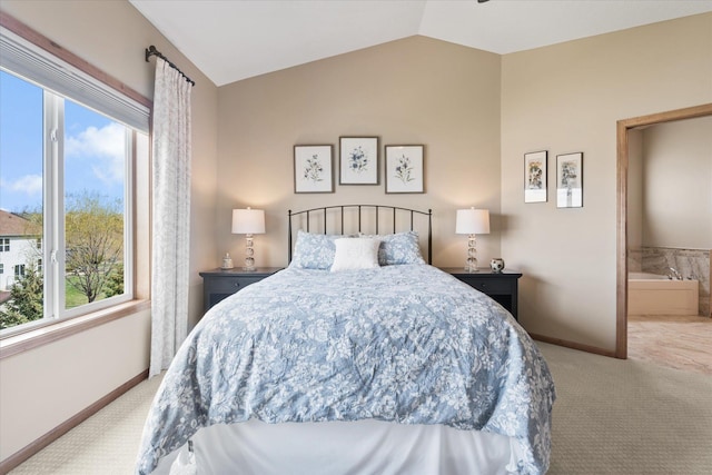 carpeted bedroom with lofted ceiling and baseboards