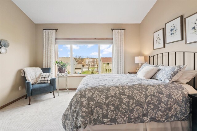 carpeted bedroom with baseboards