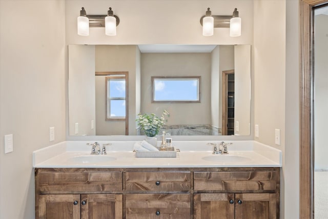 bathroom with a sink and double vanity