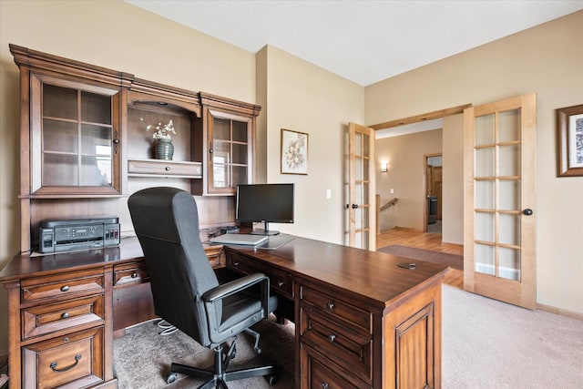 office space featuring light colored carpet and french doors
