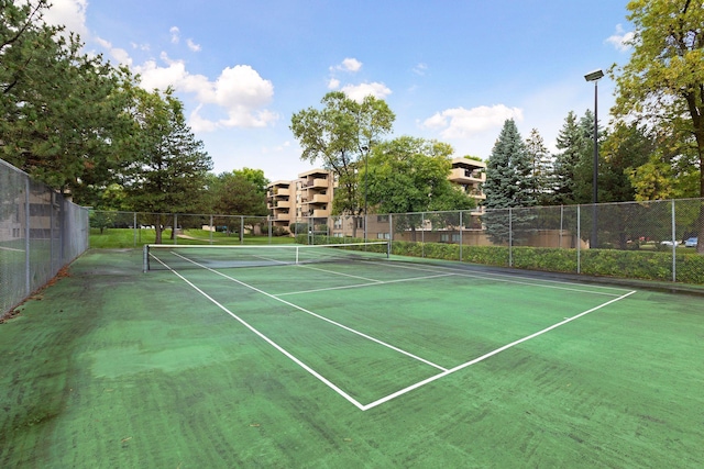 view of sport court with fence