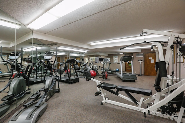workout area with a textured ceiling
