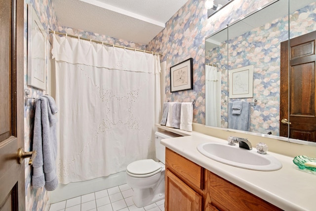 bathroom featuring a textured ceiling, toilet, wallpapered walls, tile patterned flooring, and vanity