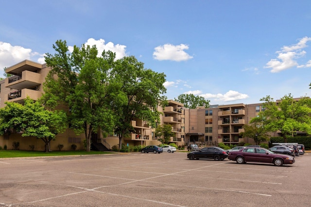 view of property with uncovered parking