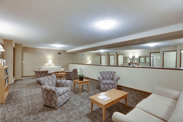 living room featuring a textured ceiling, carpet flooring, baseboards, and visible vents