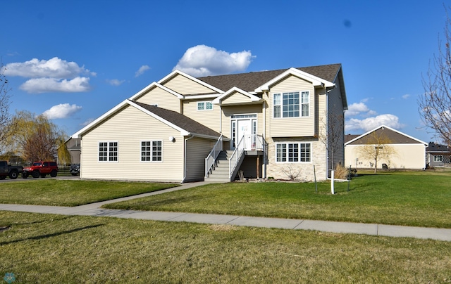 split foyer home with a front lawn
