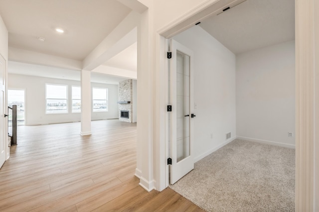 hall with baseboards, recessed lighting, visible vents, ornate columns, and light wood finished floors