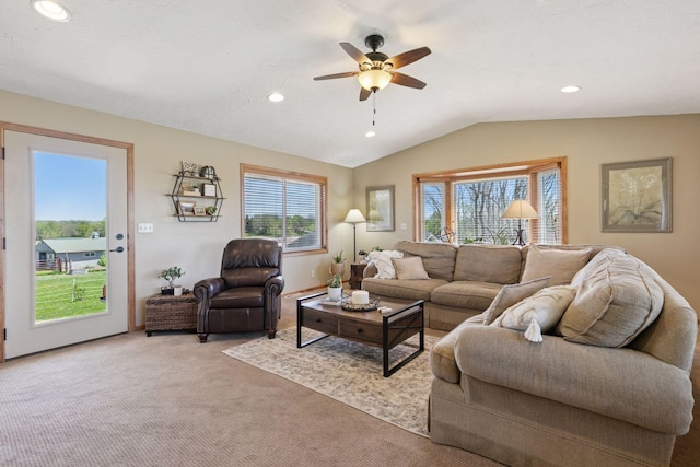living area with light carpet, ceiling fan, lofted ceiling, and recessed lighting