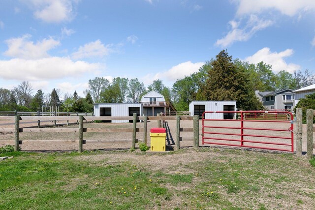 view of yard featuring a pole building, an exterior structure, and an outdoor structure