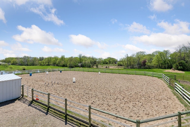 view of property's community with a view of rural / pastoral area and an enclosed riding area