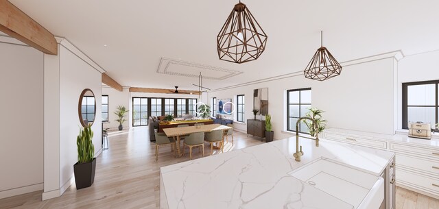 interior space featuring beam ceiling and light wood finished floors