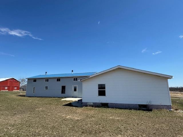 rear view of property featuring crawl space