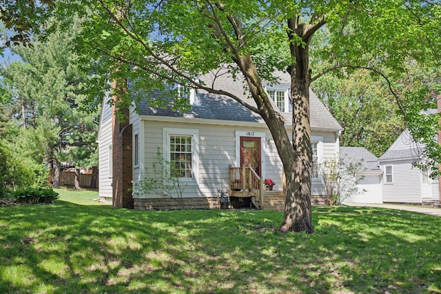 view of front of home featuring a shingled roof and a chimney