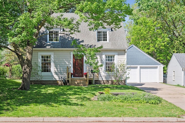 cape cod-style house featuring a front lawn, driveway, roof with shingles, and an attached garage