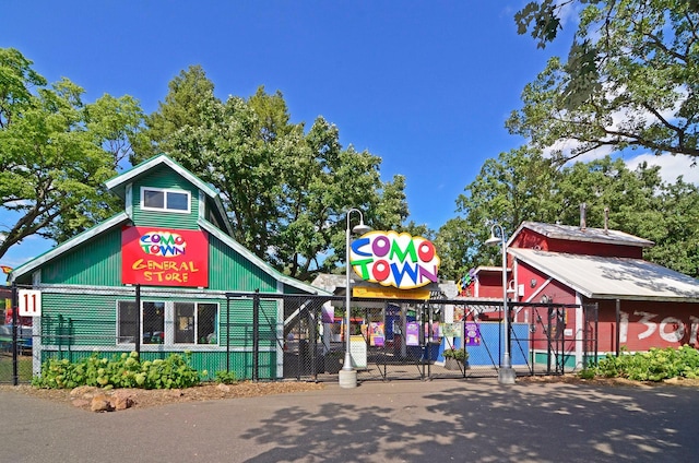 view of building exterior with fence