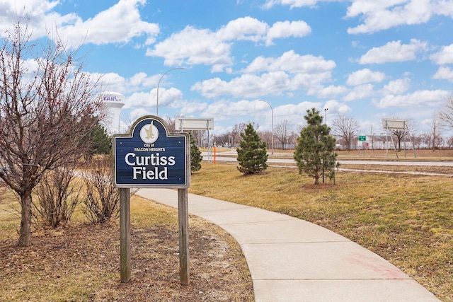 view of home's community with a yard