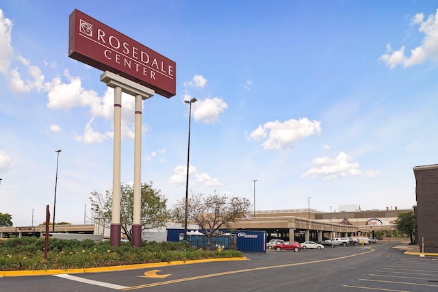 view of commercial property featuring uncovered parking