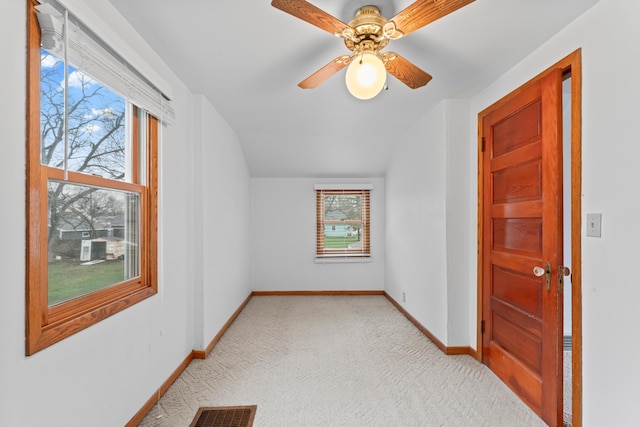 bonus room with a ceiling fan, visible vents, vaulted ceiling, baseboards, and carpet floors
