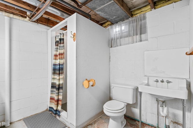 bathroom featuring a stall shower, toilet, and unfinished concrete flooring
