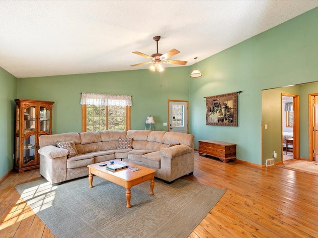 1587 Stallion Rd SW, Pillager, MN 56473 - living room with high vaulted ceiling, visible vents, baseboards, ceiling fan, and light wood-style floors
