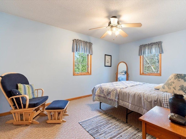 1587 Stallion Rd SW, Pillager, MN 56473 - bedroom featuring a textured ceiling, carpet flooring, baseboards, and a ceiling fan