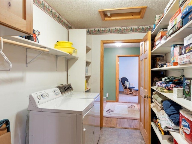 1587 Stallion Rd SW, Pillager, MN 56473 - laundry area featuring laundry area, a textured ceiling, attic access, and washer and dryer