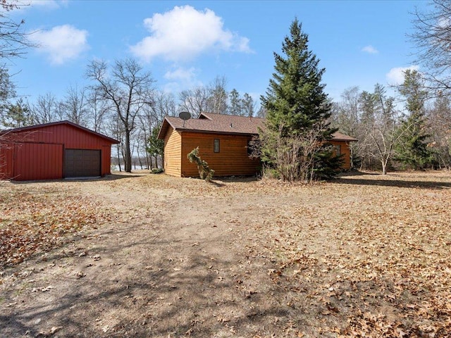 1587 Stallion Rd SW, Pillager, MN 56473 - view of side of property featuring driveway, an outdoor structure, and a garage