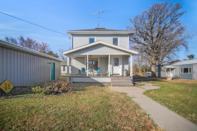 13150 345th Ave, Waseca, MN 56093 - american foursquare style home with a front yard and covered porch