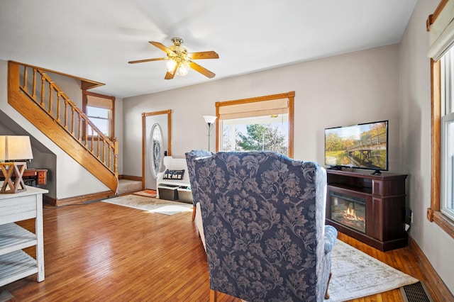 13150 345th Ave, Waseca, MN 56093 - interior space with stairway, baseboards, a ceiling fan, and wood finished floors