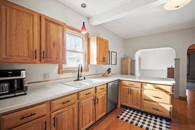 13150 345th Ave, Waseca, MN 56093 - kitchen featuring a peninsula, stainless steel dishwasher, beam ceiling, arched walkways, and a sink