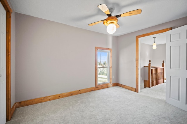 13150 345th Ave, Waseca, MN 56093 - unfurnished room featuring carpet flooring, baseboards, and a ceiling fan