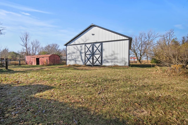 13150 345th Ave, Waseca, MN 56093 - view of pole building featuring fence and a lawn