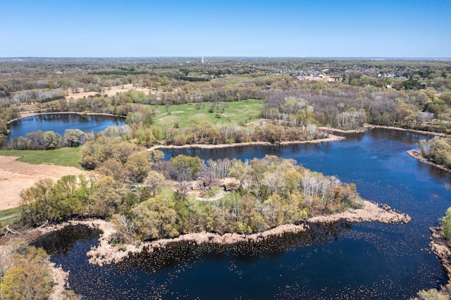 aerial view of a nearby body of water and a heavily wooded area