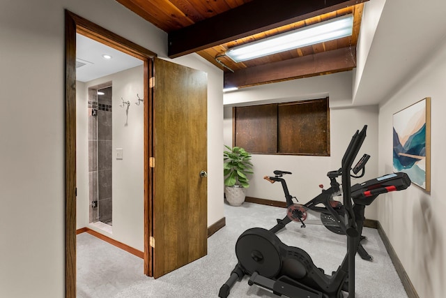 exercise area featuring wood ceiling, baseboards, and carpet floors