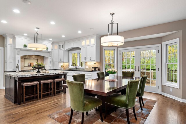 2012 Pine Ridge Dr W, Saint Paul, MN 55118 - dining space with dark wood finished floors, baseboards, french doors, and recessed lighting