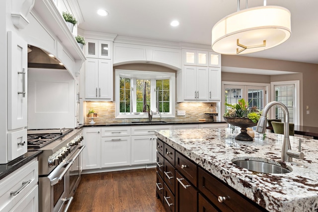 2012 Pine Ridge Dr W, Saint Paul, MN 55118 - kitchen with a sink, white cabinets, dark brown cabinets, and range with two ovens
