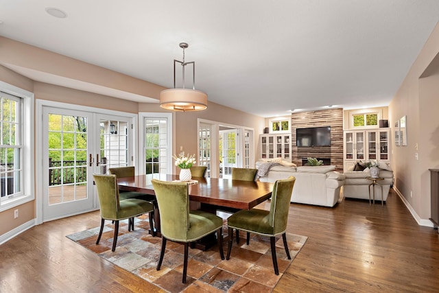2012 Pine Ridge Dr W, Saint Paul, MN 55118 - dining space with baseboards, french doors, and wood finished floors