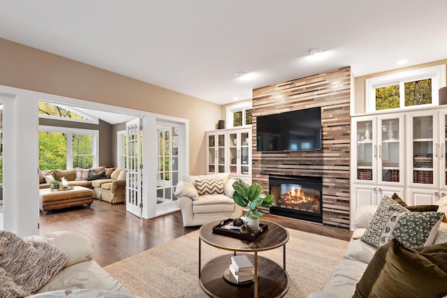 2012 Pine Ridge Dr W, Saint Paul, MN 55118 - living room featuring a tiled fireplace, recessed lighting, lofted ceiling, and wood finished floors