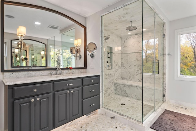 2012 Pine Ridge Dr W, Saint Paul, MN 55118 - full bath featuring a healthy amount of sunlight, a marble finish shower, vanity, and visible vents