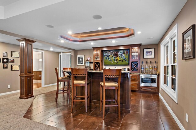 2012 Pine Ridge Dr W, Saint Paul, MN 55118 - bar with a dry bar, a raised ceiling, recessed lighting, stainless steel microwave, and decorative columns