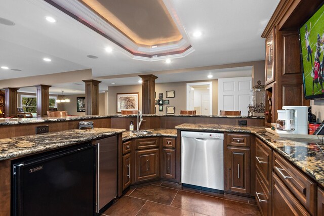 2012 Pine Ridge Dr W, Saint Paul, MN 55118 - kitchen with stainless steel dishwasher, a sink, decorative columns, and refrigerator